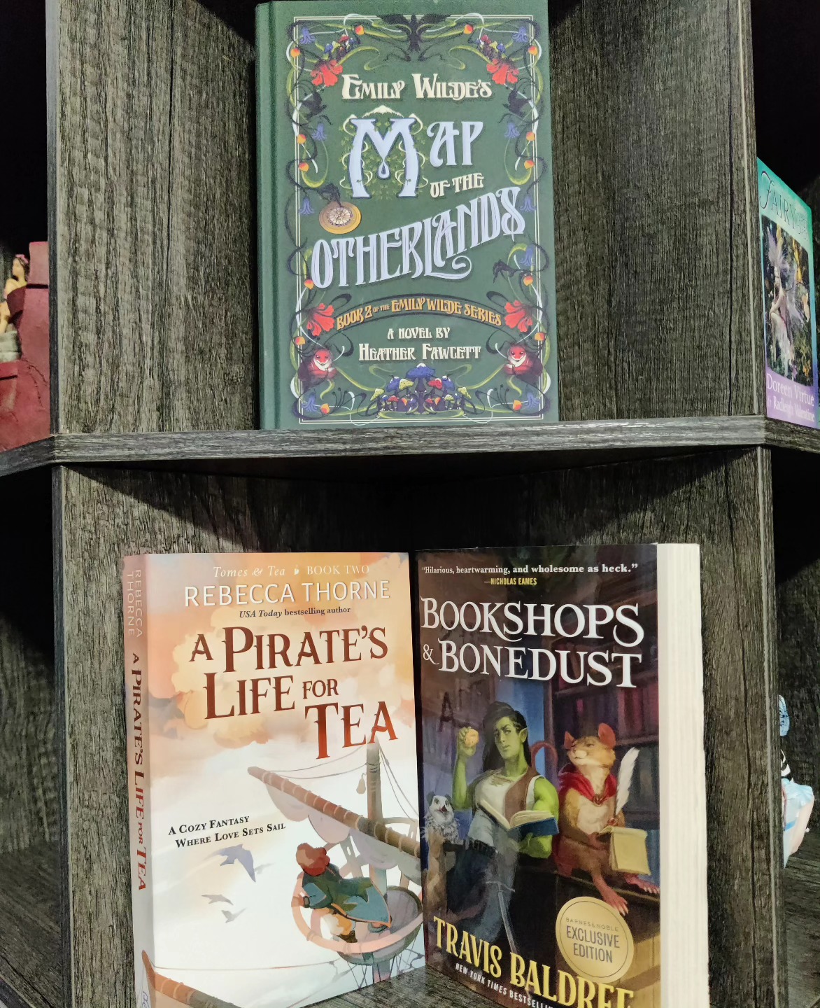 It's been a year. 

I had a kid.
I endured the insane first eleven months of postpartum.
I made a big career move.
I had to say goodbye to my dog, who was essentially my first child. 

Pictured are the three books I read in 2024. Notice a theme? Yes, they're all cozy because at the end of the day I need a warm hug.

I'm also going to write a cozy fantasy series in 2025. I believe the genre holds so much quiet healing power that many of us need right now.

Here's to 2025 being a year of healing. Check these titles out if you need an escape that you know will end with all the good feels.

#cozyfantasy #cozyfantasybooks #bookshopsandbonedust #emilywildesmapoftheotherlands #postpartum #momlife #fantasybooks #apirateslifefortea #cozy #goodbye2024 #fantasyreads #amreadingfantasy  #shelfie #prettycovers #fantasybookstagram